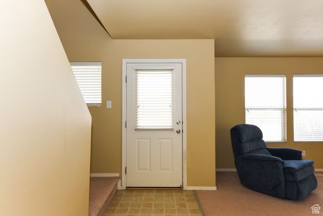 Doorway to outside with light carpet and baseboards | Image 7