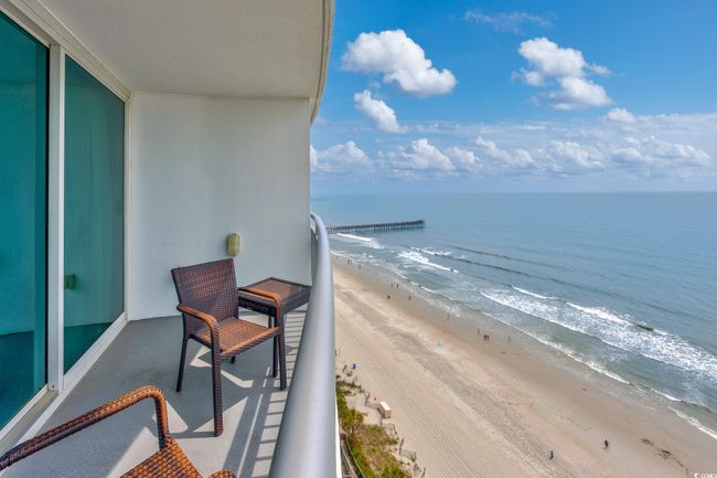 Balcony with a beach view and a water view | Image 20