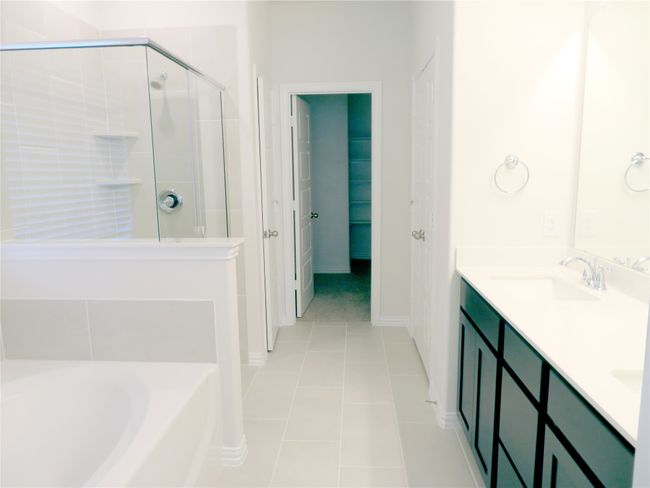 Master bath with separate tub and shower and a very large walk in closet | Image 8