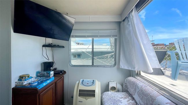 Bedroom featuring multiple windows and heating unit | Image 8