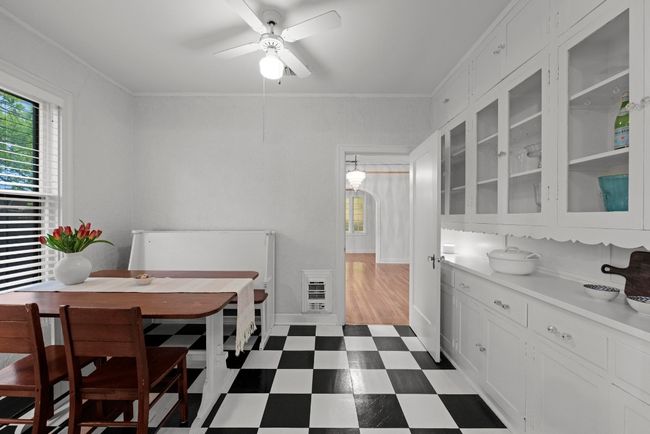 This breakfast room is off of the dining room. | Image 13