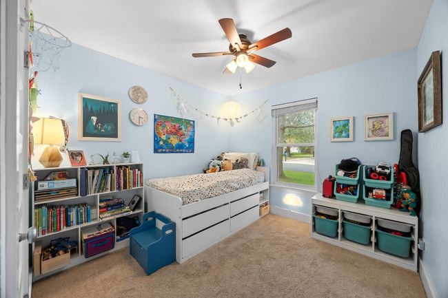 Carpeted bedroom with ceiling fan | Image 10
