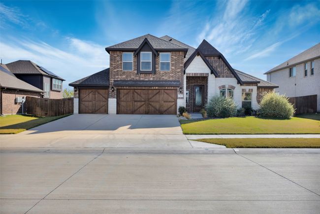 View of front of property featuring a 3 car garage and a front lawn | Image 6