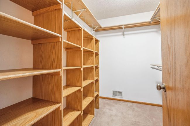 Spacious walk-in primary closet | Image 11