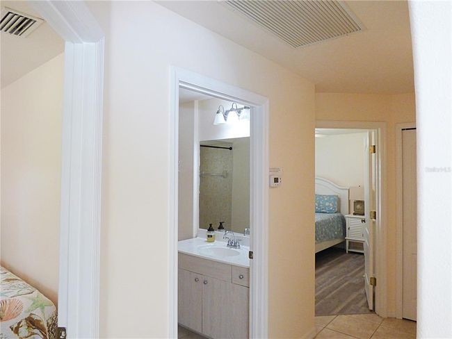 guest hallway with access to the 2 bedrooms the guest bath and the linen closet which is opening both side Hallway/laundry | Image 54