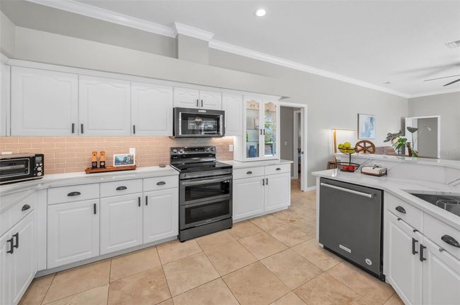 Chef's kitchen loaded with cabinets storage | Image 15