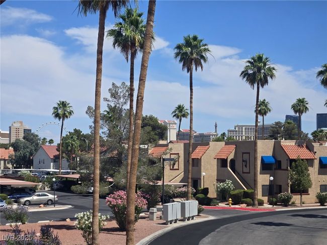 View of asphalt street with street lighting and a residential view | Image 15