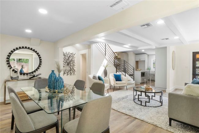 The dining room has views into the living room and kitchen - perfect for dinner parties! | Image 11