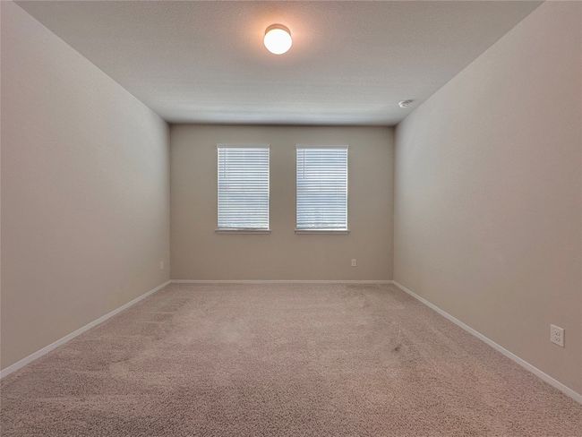Spare room featuring light colored carpet | Image 17