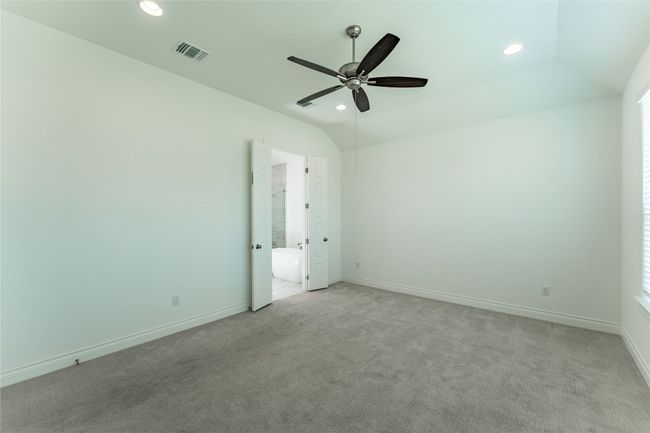 Spare room with a ceiling fan, light colored carpet, lofted ceiling, and recessed lighting | Image 25