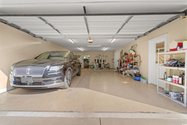 Garage with a garage door opener | Image 28