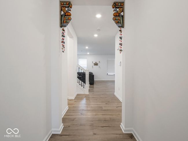 hall featuring recessed lighting, stairs, baseboards, and wood finished floors | Image 8