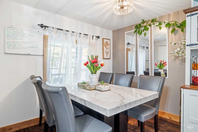 Dining room with dark wood finished floors | Image 10