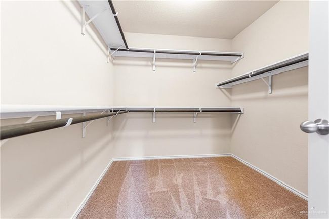 Walk in closet with carpet | Image 16