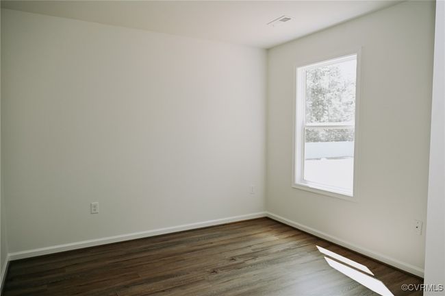 Empty room with dark hardwood / wood-style floors and a wealth of natural light | Image 10