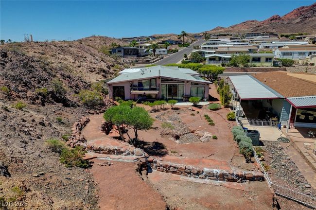 Aerial view of property and surrounding area featuring a mountain backdrop | Image 60