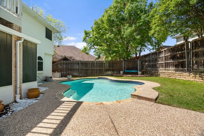 View of pool with a fenced in pool, a patio, and a fenced backyard | Image 33