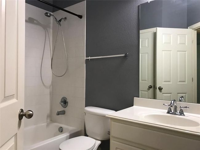 Full bath featuring toilet, bathtub / shower combination, and vanity | Image 15