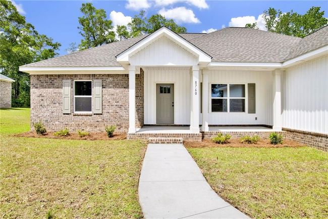 View of front of property with roof with shingles, covered porch, a front yard, and brick siding | Image 7