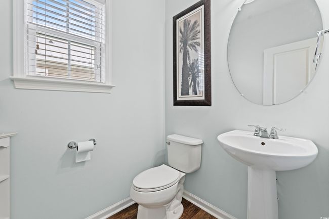 Half bath with plenty of natural light on the second level off of the living room. | Image 18