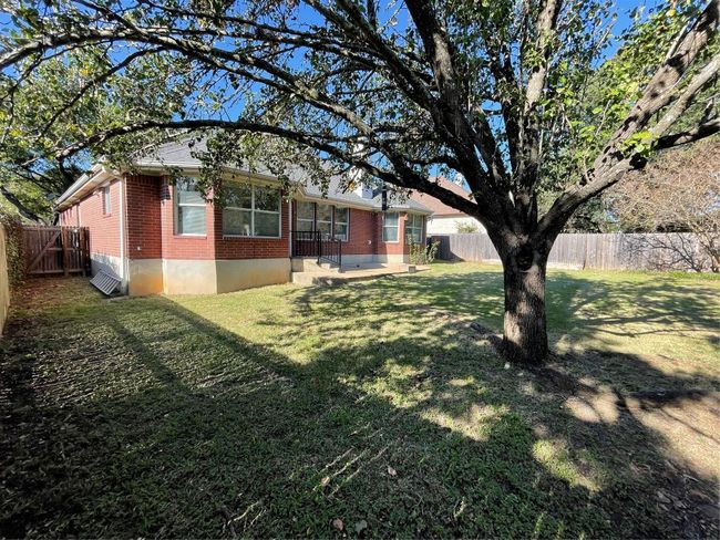 View of fenced backyard | Image 34
