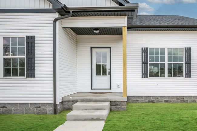 Covered Porch and Concrete Sidewalk Note: Green Grass Edits on all Exterior Photos | Image 30