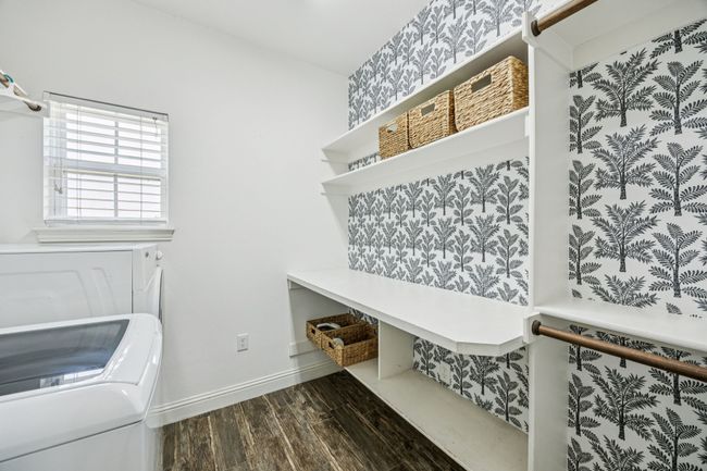 Mudroom featuring washing machine and clothes dryer and dark wood finished floors | Image 17