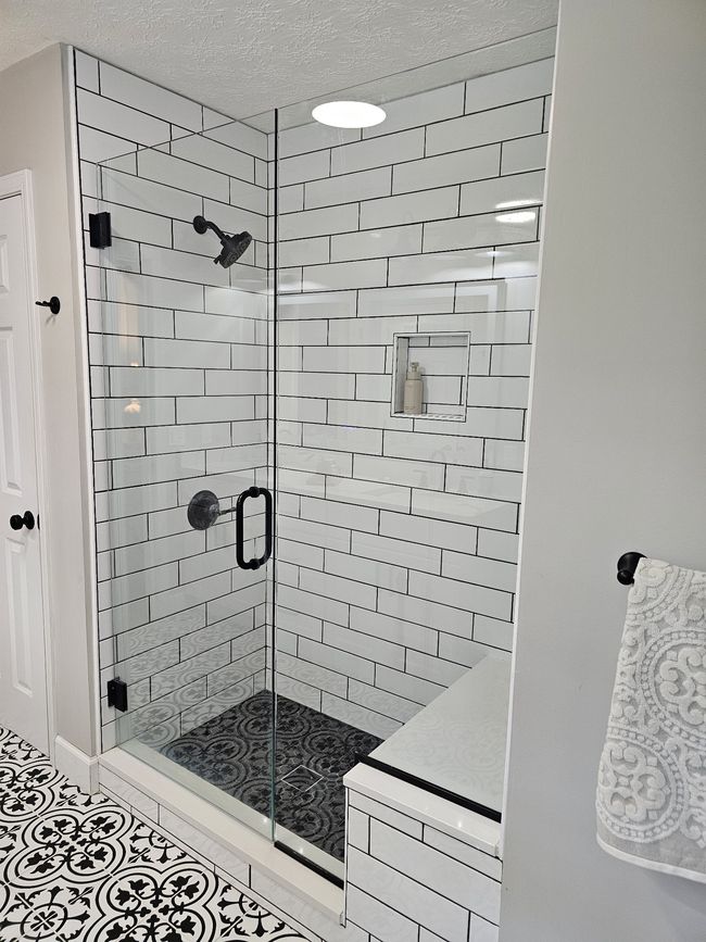 Gorgeous tile shower, shower bench and glass doors. Rinse all your cares away after a long day. | Image 24