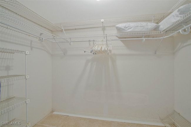 Walk in closet in primary bed room | Image 25