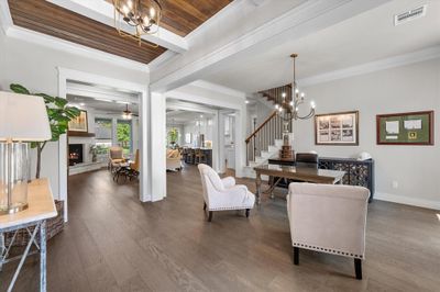 WOW! Open concept is accented by wood flooring & ceilings as you enter the home! | Image 3