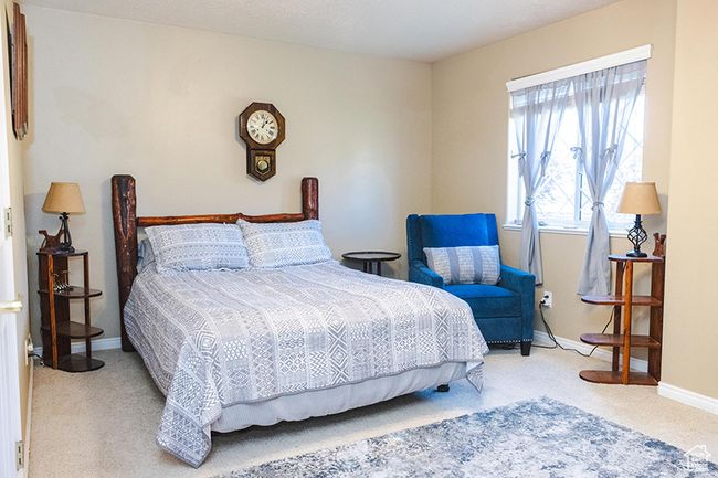 Bedroom with carpet and baseboards | Image 16