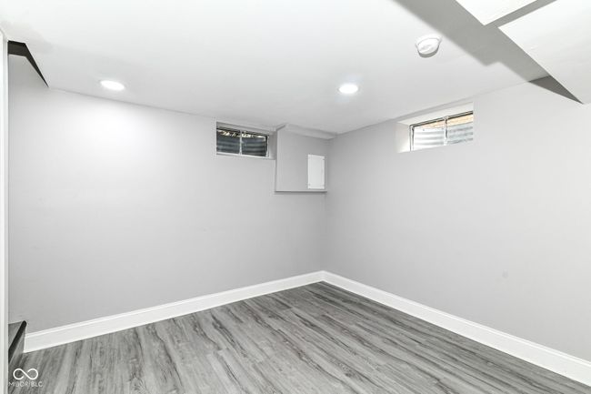 basement with recessed lighting, wood finished floors, and baseboards | Image 31