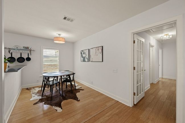 The living room seamlessly connects to the dining area. | Image 6