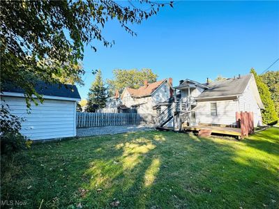 View of yard with a wooden deck | Image 3