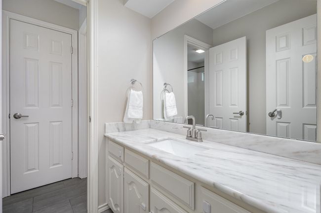 Jack & Jill Bathroom with marble vanity, walk-in closet | Image 24