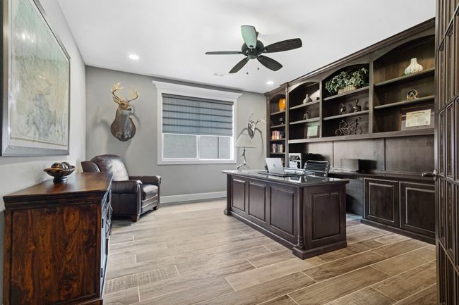 Office space featuring a ceiling fan, baseboards, light wood-style floors, and recessed lighting | Image 16