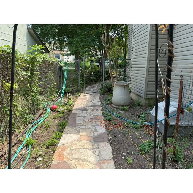 View of side yard with walkway to front yard | Image 13