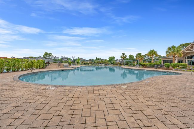 Community pool featuring a patio area | Image 16