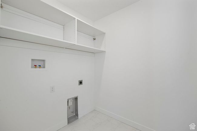 From daily loads to weekend catch-up, this roomy laundry space makes chores feel a little more seamless. | Image 17