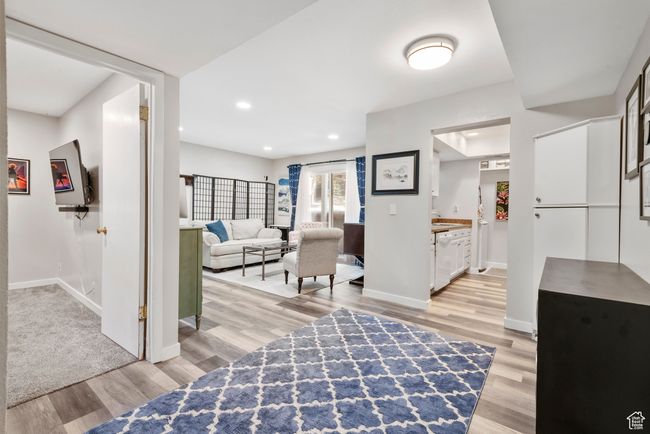 Living room featuring light wood-type flooring and recessed lighting | Image 13