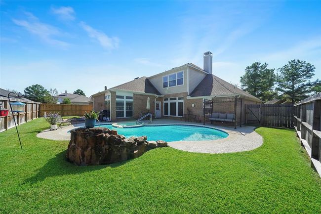 Look at this nice size yard with a pool/ hot tub with plenty of green space. POOL can be Heated! | Image 34
