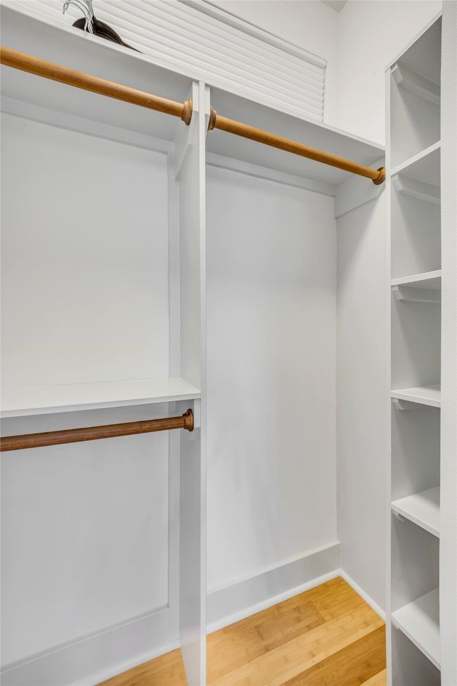 Spacious closet with hardwood / wood-style floors | Image 23