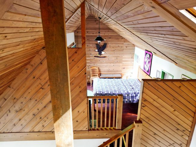 Interior space featuring wood walls, wood ceiling, and vaulted ceiling | Image 13