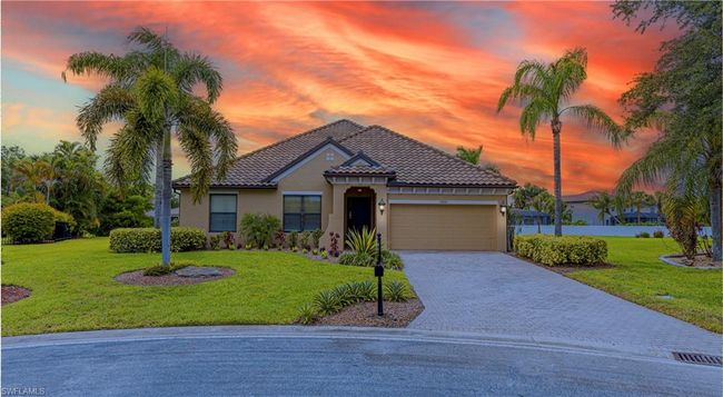 Mediterranean / spanish home featuring decorative driveway, a garage, a front lawn, and stucco siding | Image 29