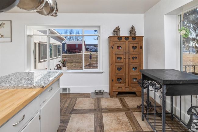 Kitchen with white cabinetry | Image 9
