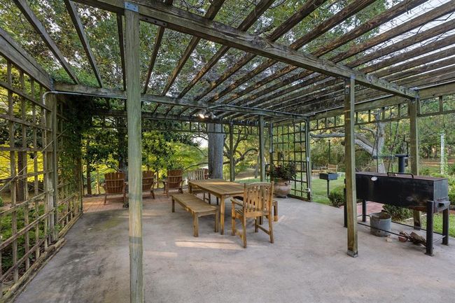 [Washington Arbor] Covers a 20’ by 20’ concrete patio and BBQ pit overlooking the river and gardens. | Image 37