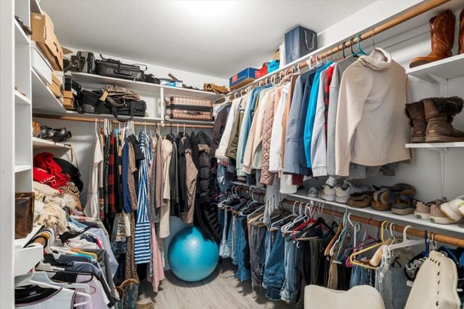 Spacious closet featuring wood finished floors | Image 26