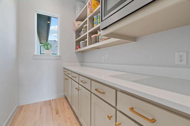 Bar featuring light wood-type flooring and baseboards | Image 19