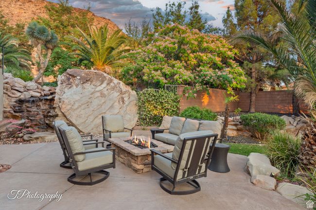 Patio terrace at dusk featuring an outdoor fire pit and a patio | Image 63
