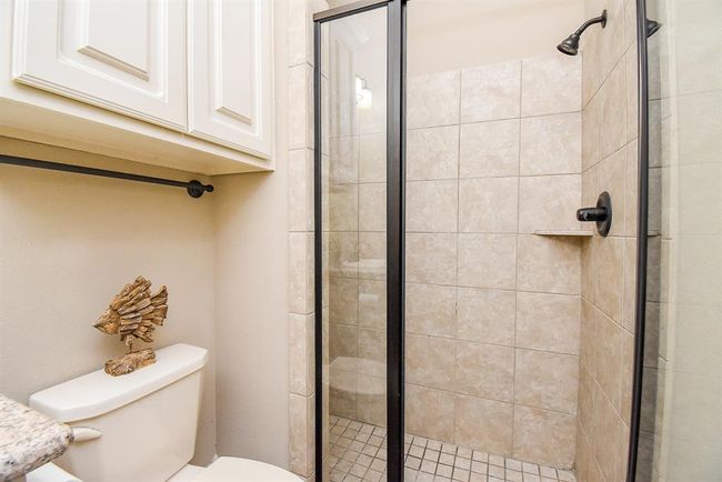 A shower with glass doors! | Image 35